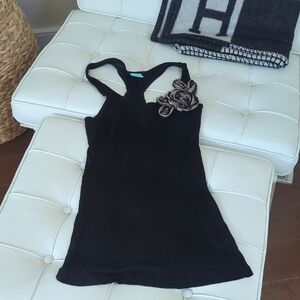 Elegant Black Sleeveless Top with Floral Accent